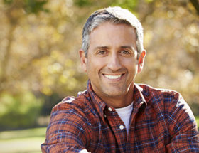 man smiling in autumn