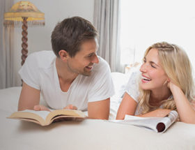 couple talking on the bed